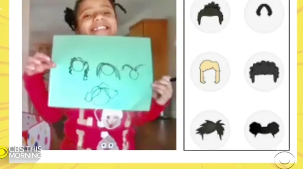 7-year old Morgan Bugg displays her drawing of hairstyles that reflect her identity