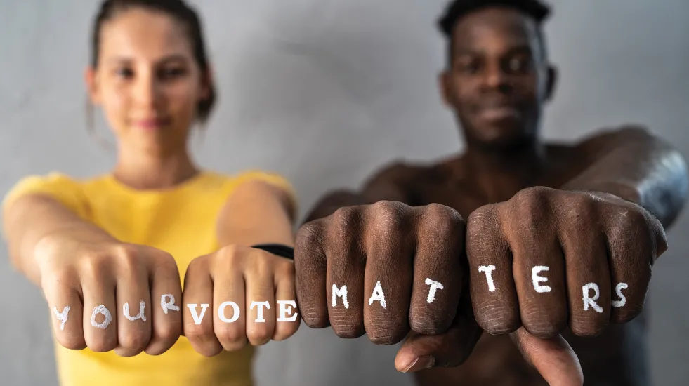 Fists with the slogan "Your Vote Matters"