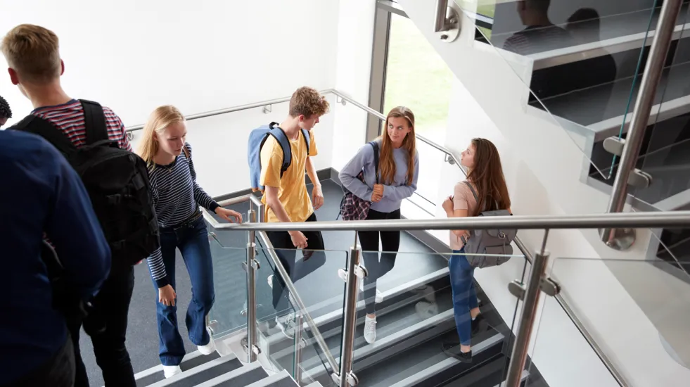 High school students walking on stairs