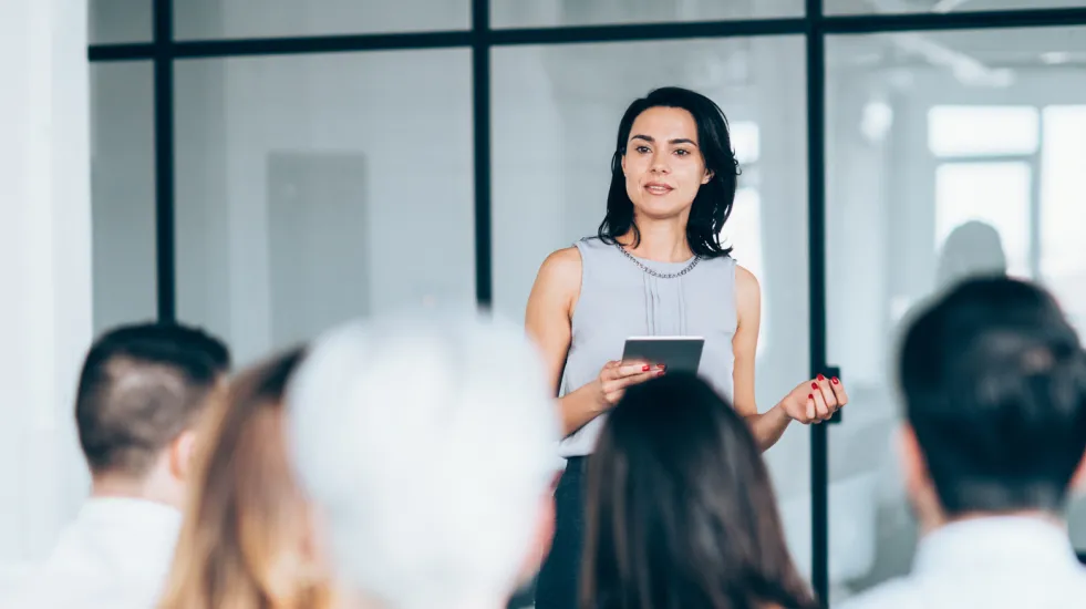 Businesswoman leading training class for professionals