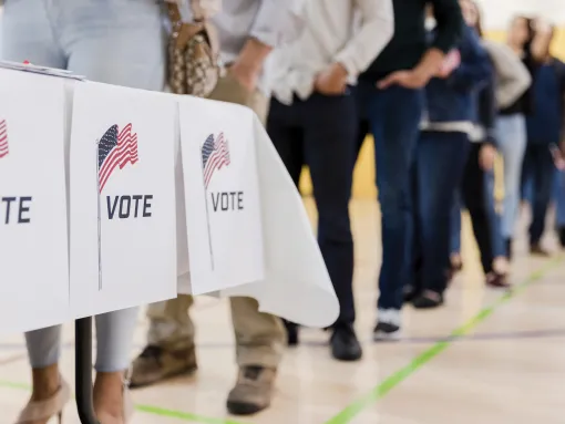 Low Angle View of People Lined Up to Vote