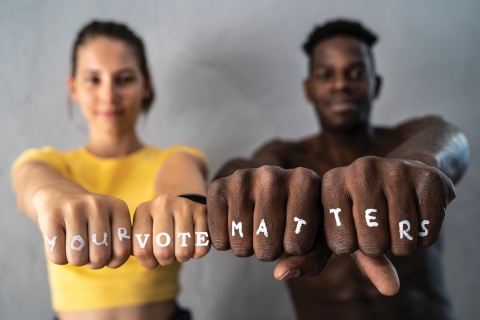 Fists with the slogan "Your Vote Matters"