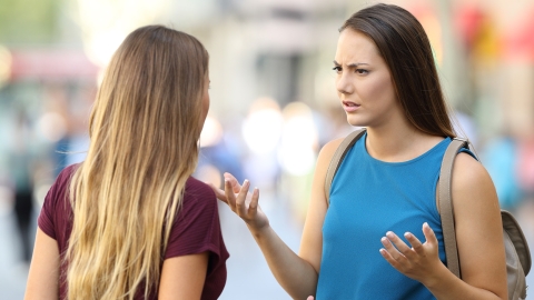Two young women arguing